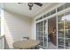 Outdoor balcony with a ceiling fan and sliding glass doors to the living area at 5750 Oyster Catcher Dr. # 822, North Myrtle Beach, SC 29582