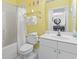 Bathroom featuring a tub-shower combo, vanity, and view into the dining room at 5750 Oyster Catcher Dr. # 822, North Myrtle Beach, SC 29582