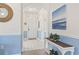 Welcoming entrance hallway with elegant decor, a stylish console table, and soothing wall colors at 5750 Oyster Catcher Dr. # 822, North Myrtle Beach, SC 29582