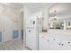 Functional kitchen with white appliances, cabinets, and a view into the inviting living space at 5750 Oyster Catcher Dr. # 822, North Myrtle Beach, SC 29582
