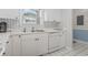 Bright kitchen featuring white cabinets, a dishwasher, and a convenient double sink setup at 5750 Oyster Catcher Dr. # 822, North Myrtle Beach, SC 29582
