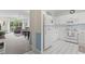 Bright kitchen with white cabinets, appliances, and a seamless transition into the cozy living area at 5750 Oyster Catcher Dr. # 822, North Myrtle Beach, SC 29582