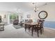 Cozy living area with comfortable seating, a ceiling fan, and sliding glass doors leading to the outdoors at 5750 Oyster Catcher Dr. # 822, North Myrtle Beach, SC 29582
