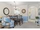 Open-concept living and dining area with dining set, kitchen access, and white painted walls at 5750 Oyster Catcher Dr. # 822, North Myrtle Beach, SC 29582