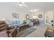 Inviting living room with a comfortable sofa, accent chair, and view into the dining area at 5750 Oyster Catcher Dr. # 822, North Myrtle Beach, SC 29582
