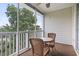 Enjoy outdoor living with this screened-in porch featuring a ceiling fan and comfortable seating at 5801 Oyster Catcher Dr. # 332, North Myrtle Beach, SC 29582
