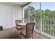 The screened-in porch provides a relaxing outdoor space with seating and views of the surrounding landscape at 5801 Oyster Catcher Dr. # 332, North Myrtle Beach, SC 29582