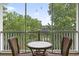 This screened-in porch offers serene views and a cozy spot to unwind with an outdoor table and chairs at 5801 Oyster Catcher Dr. # 332, North Myrtle Beach, SC 29582