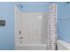 Clean, white bathroom featuring a shower/tub combination and charming polka dot shower curtain at 5801 Oyster Catcher Dr. # 332, North Myrtle Beach, SC 29582