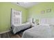 Twin bedroom offers a bright, airy feel with natural light and comfortable sleeping space at 5801 Oyster Catcher Dr. # 332, North Myrtle Beach, SC 29582