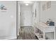 Inviting entryway featuring a light fixture, wood-look floors, and a white console table at 5801 Oyster Catcher Dr. # 332, North Myrtle Beach, SC 29582