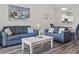 Cozy living room featuring stylish furniture, decor and wood look flooring at 5801 Oyster Catcher Dr. # 332, North Myrtle Beach, SC 29582