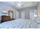 Primary bedroom featuring a tray ceiling, fan, television, and ensuite bathroom at 601 N Hillside Dr. # 4434, North Myrtle Beach, SC 29582