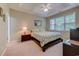 Comfortable bedroom featuring a tray ceiling, fan, and bright natural light at 601 N Hillside Dr. # 4434, North Myrtle Beach, SC 29582