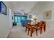 Light-filled dining room and living room with vaulted ceiling and sliding glass doors to the balcony at 601 N Hillside Dr. # 4434, North Myrtle Beach, SC 29582