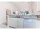 Kitchen featuring stone countertops, stainless steel sink, and white appliances at 601 N Hillside Dr. # 4434, North Myrtle Beach, SC 29582