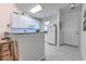 Bright kitchen features white cabinets, tile floors and bar-height counter seating at 601 N Hillside Dr. # 4434, North Myrtle Beach, SC 29582