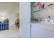 Convenient laundry area with a washer and dryer, as well as shelving for storage at 601 N Hillside Dr. # 4434, North Myrtle Beach, SC 29582