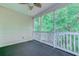 Relaxing screened porch with ceiling fan and view of lush greenery at 601 N Hillside Dr. # 4434, North Myrtle Beach, SC 29582