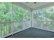 Outdoor screened porch with ceiling fan; perfect for enjoying the surrounding nature at 601 N Hillside Dr. # 4434, North Myrtle Beach, SC 29582