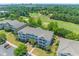 Aerial view showcasing the condos, lush greenery, and a golf course at 6203 Catalina Dr. # 1333, North Myrtle Beach, SC 29582