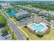 An aerial view showcasing community amenities including a pool, pond, parking, and beautifully landscaped grounds at 6203 Catalina Dr. # 1333, North Myrtle Beach, SC 29582