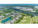 An aerial view showcases waterfront condos near shopping, a golf course, and a tranquil river at 6203 Catalina Dr. # 1333, North Myrtle Beach, SC 29582