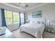 Bright bedroom with a large window, a comfortable bed and stylish decor at 6203 Catalina Dr. # 1333, North Myrtle Beach, SC 29582