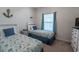 Guest bedroom with two beds, nautical decor, and a bright window at 6203 Catalina Dr. # 1333, North Myrtle Beach, SC 29582