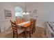 Cozy dining area with a wooden table set, complemented by stylish decor and an open view to the kitchen at 6203 Catalina Dr. # 1333, North Myrtle Beach, SC 29582