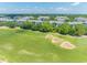 A picturesque golf course view with lush green fairways, sand traps, and upscale residential condos in the background at 6203 Catalina Dr. # 1333, North Myrtle Beach, SC 29582