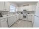 Functional kitchen with white appliances, ample counter space, and neutral backsplash, perfect for everyday cooking at 6203 Catalina Dr. # 1333, North Myrtle Beach, SC 29582