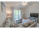 Comfortable living room with a large sectional sofa, ceiling fan, and sliding glass doors opening to a balcony at 6203 Catalina Dr. # 1333, North Myrtle Beach, SC 29582