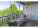 Screened porch features comfortable seating and scenic views of the surrounding greenery at 6203 Catalina Dr. # 1333, North Myrtle Beach, SC 29582