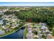 Aerial view of residential neighborhood near wooded area and lake at 675 Vermillion Dr., Little River, SC 29566