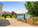 Scenic backyard view overlooking a serene pond and manicured landscaping with neighboring properties at 675 Vermillion Dr., Little River, SC 29566