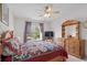 Bedroom with a ceiling fan, wood furniture and a view of the outdoors at 675 Vermillion Dr., Little River, SC 29566