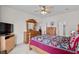 Bedroom with a wood dresser, ceiling fan and a view of the hallway at 675 Vermillion Dr., Little River, SC 29566