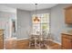 Charming kitchen nook with a round table, chairs, and a window for natural light at 675 Vermillion Dr., Little River, SC 29566
