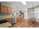 A clean kitchen with stainless steel appliances, wood cabinets, granite countertops and breakfast nook at 675 Vermillion Dr., Little River, SC 29566