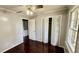 Bedroom featuring closet and door, wood floors and natural light from a window at 6805 Mclaurin Rd., Mullins, SC 29574