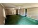 The bedroom has an open floor plan, neutral walls and green carpet at 6805 Mclaurin Rd., Mullins, SC 29574