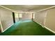 Bedroom with natural light, neutral walls, green carpet, ceiling fan, and closet at 6805 Mclaurin Rd., Mullins, SC 29574