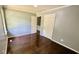 Bedroom with hardwood floors, gray walls, white doors and window to provide natural light at 6805 Mclaurin Rd., Mullins, SC 29574