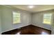 Bedroom featuring hardwood floors, gray walls, white trim and windows providing natural light at 6805 Mclaurin Rd., Mullins, SC 29574