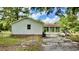 Exterior view of home showing siding, sun room and yard at 6805 Mclaurin Rd., Mullins, SC 29574