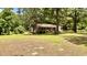Cozy single-story home surrounded by lush greenery, offering a peaceful and private setting at 6805 Mclaurin Rd., Mullins, SC 29574