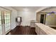 Spacious kitchen features tile countertop island, gray cabinets, and stainless steel mini refrigerator at 6805 Mclaurin Rd., Mullins, SC 29574