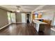 Bright living space featuring wood floors and easy access to the kitchen with island, perfect for entertaining at 6805 Mclaurin Rd., Mullins, SC 29574