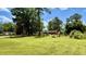 Spacious, grassy yard with mature trees, perfect for outdoor activities and relaxation at 6805 Mclaurin Rd., Mullins, SC 29574